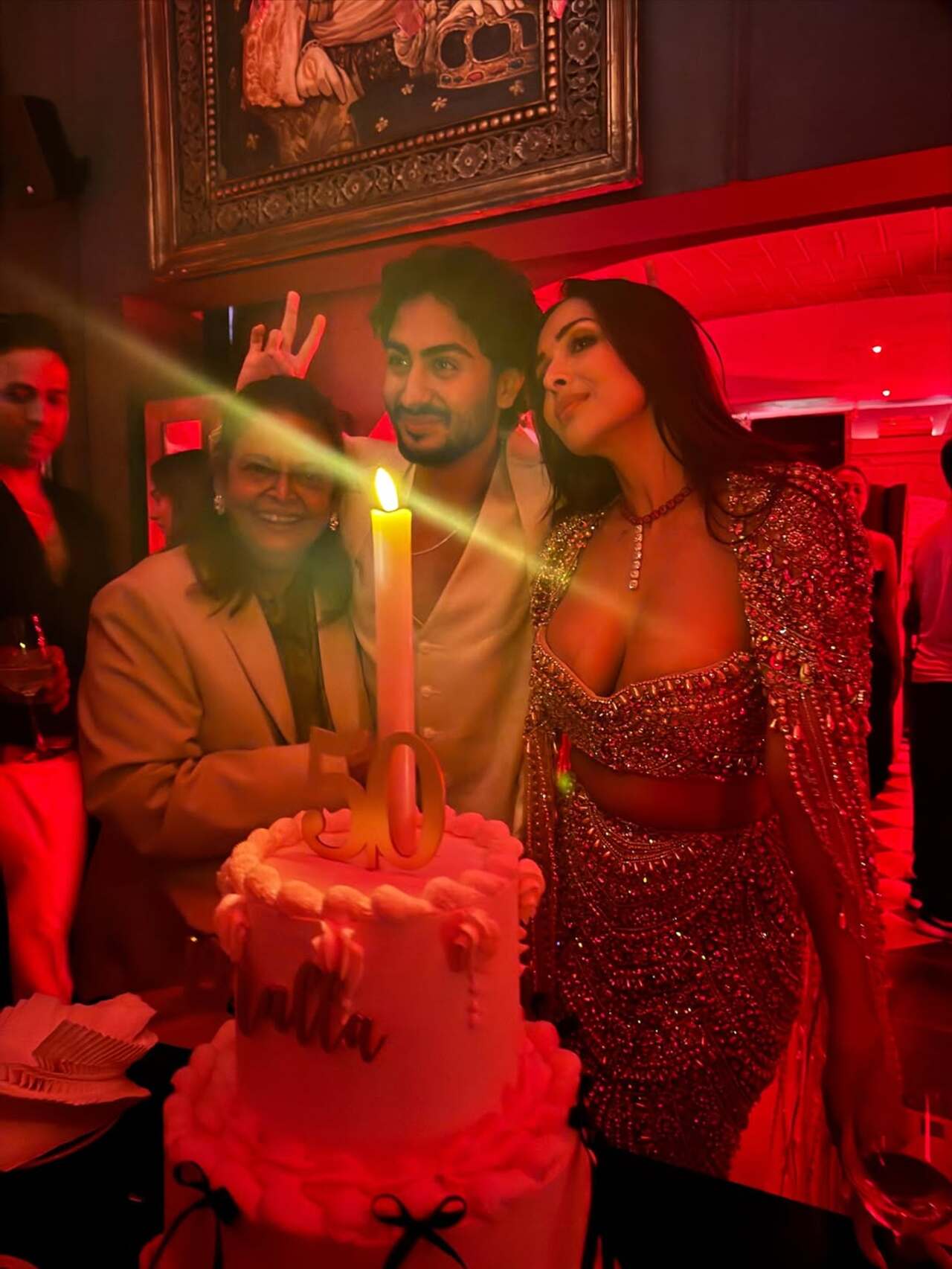 Malla was all smiles as she cut a customised cake with her son Arhaan and mother Joyce. The heartwarming moment left netizens raving about the bond the mother-son duo shares.